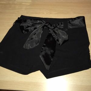 Black small shorts with silk tie and back pockets